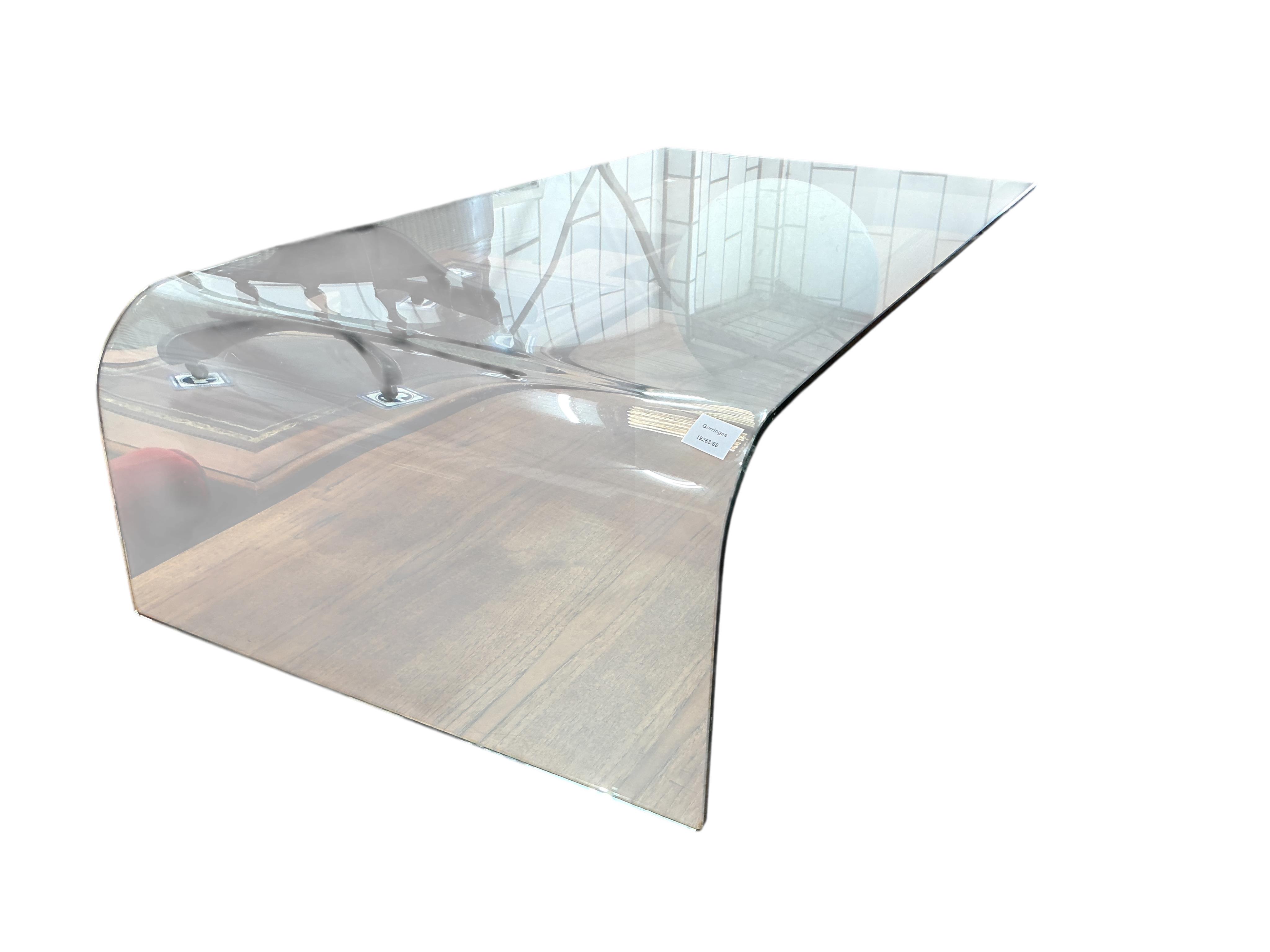 A Contemporary glass top coffee table with faux marble sphere support
